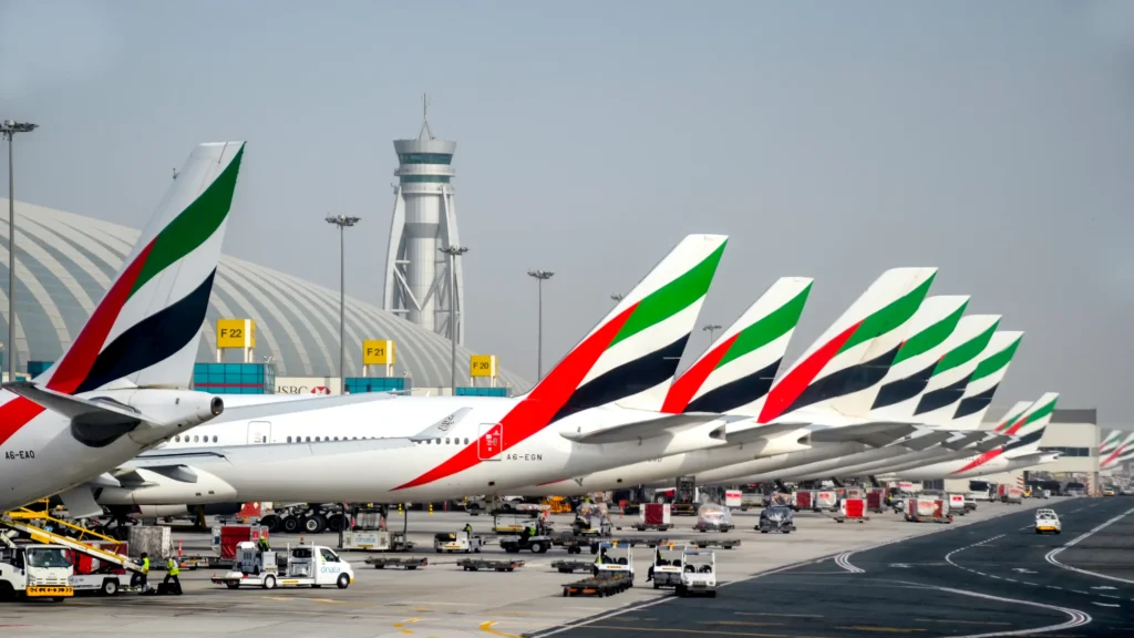 Emirates aircraft parked at Dubai International Airport representing travel and job migration opportunities connected to the UAE work permit from India process.