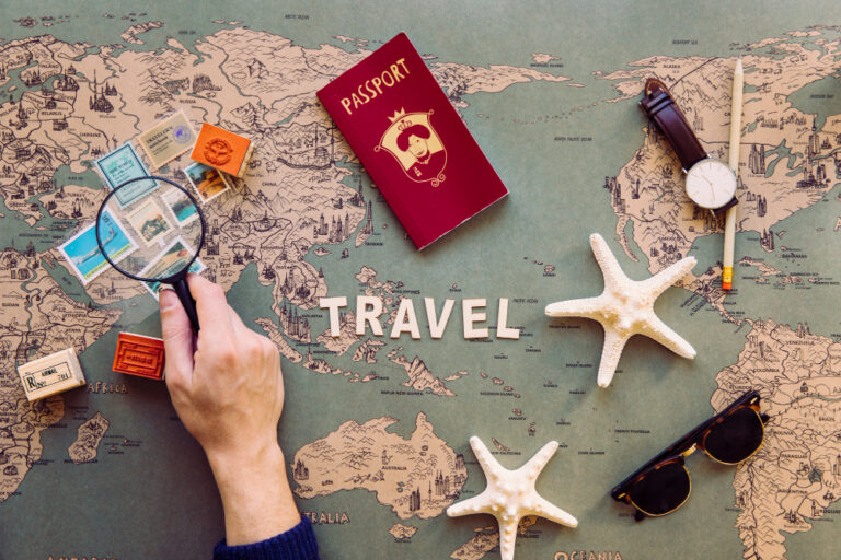 Travel planning setup with passport, map, and accessories showing preparation stage for tourist visa from India and international trip planning