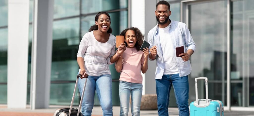 Family reunification visa process success story showing parents and child arriving together at airport with luggage after receiving spouse and children dependent visas.